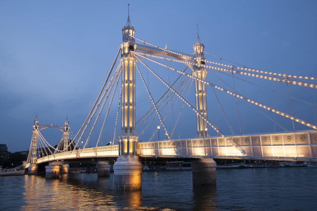 A photo depicting the view along the Albert Bridge, London.